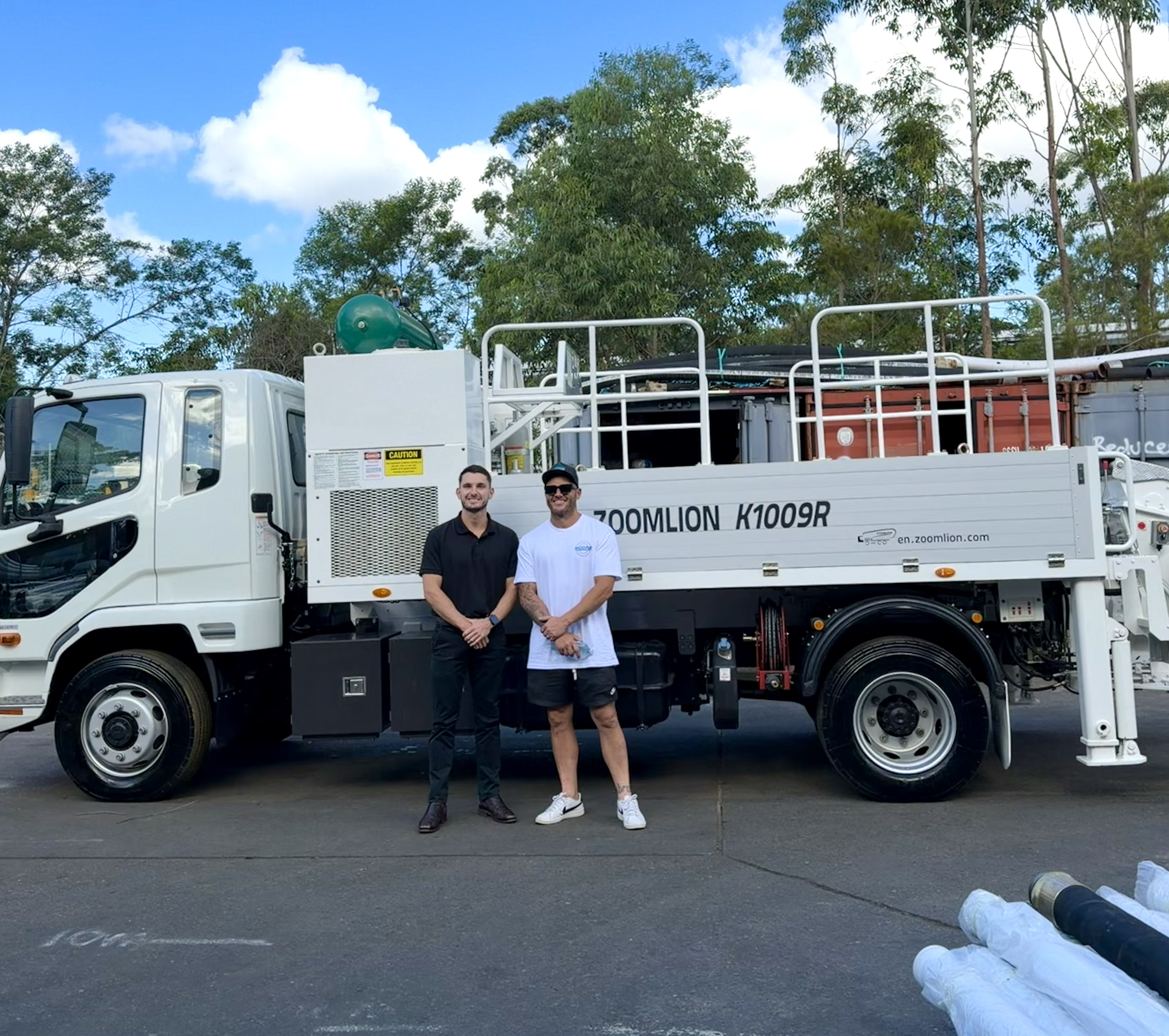 Kyle Talbot with an EverCap Finance client and financed concrete pump